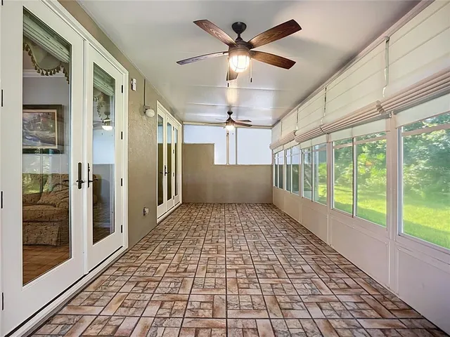 a view of empty room with windows