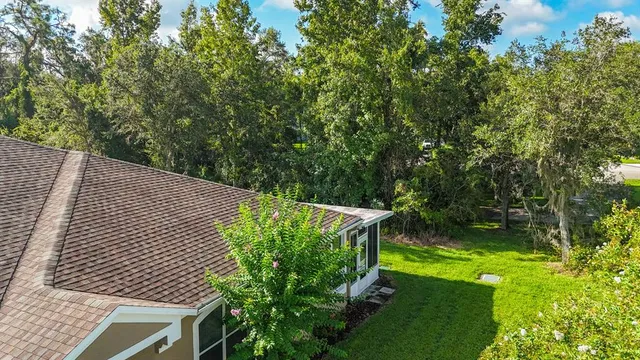 an aerial view of a house with outdoor space