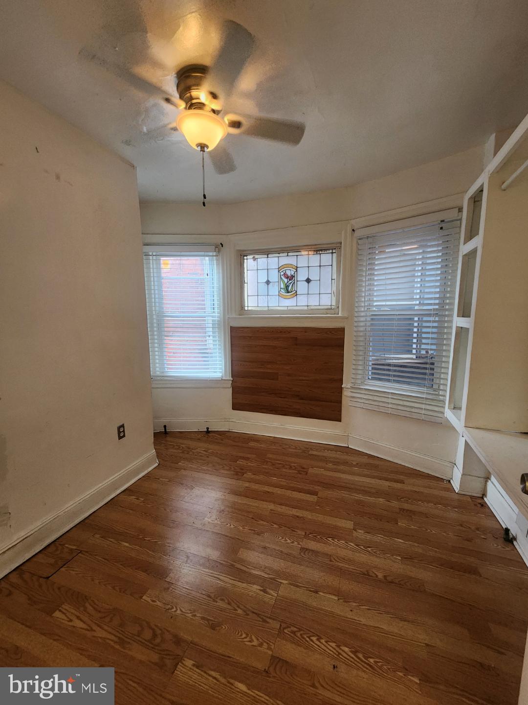 4910 Chestnut Street, Unit 2R Philadelphia, PA 19139 - Photo 5 of 5 a view of an empty room with window and wooden floor