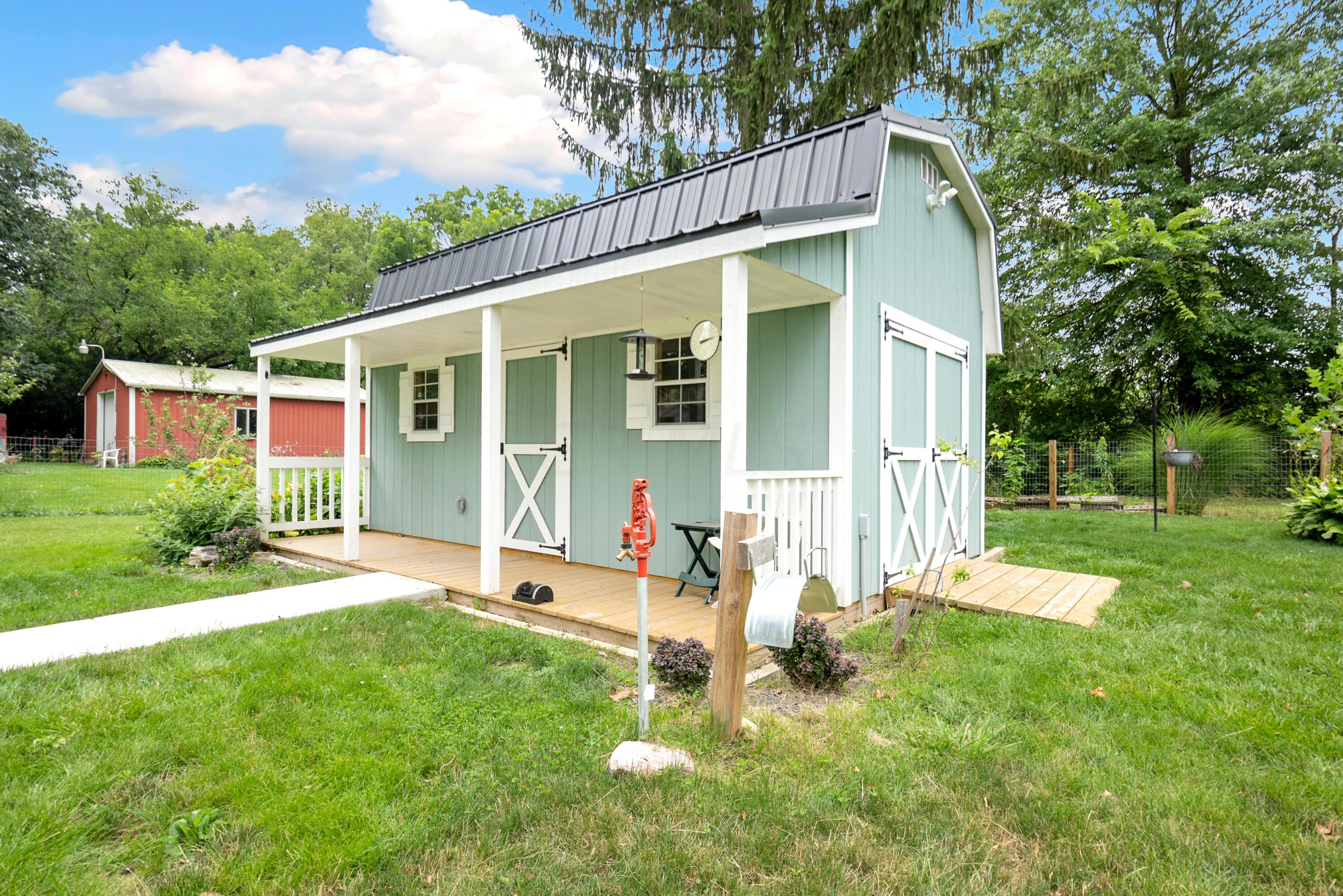 498 Acme Road Delaware, OH 43015 - Photo 37 of 53 This shed is super cute with with water & electric.