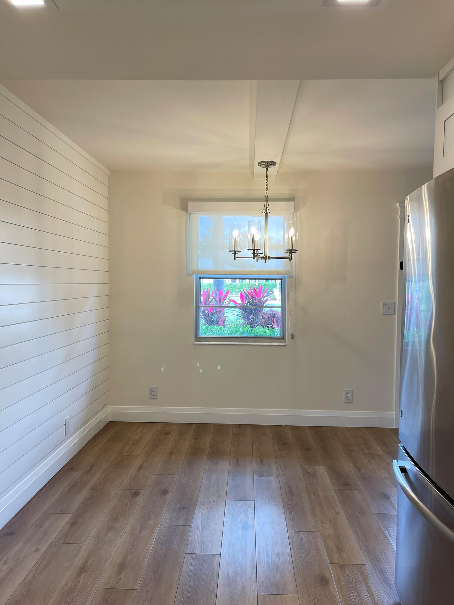 1030 Rexford B Boca Raton, FL 33434 - Photo 11 of 27 an empty room with wooden floor and window