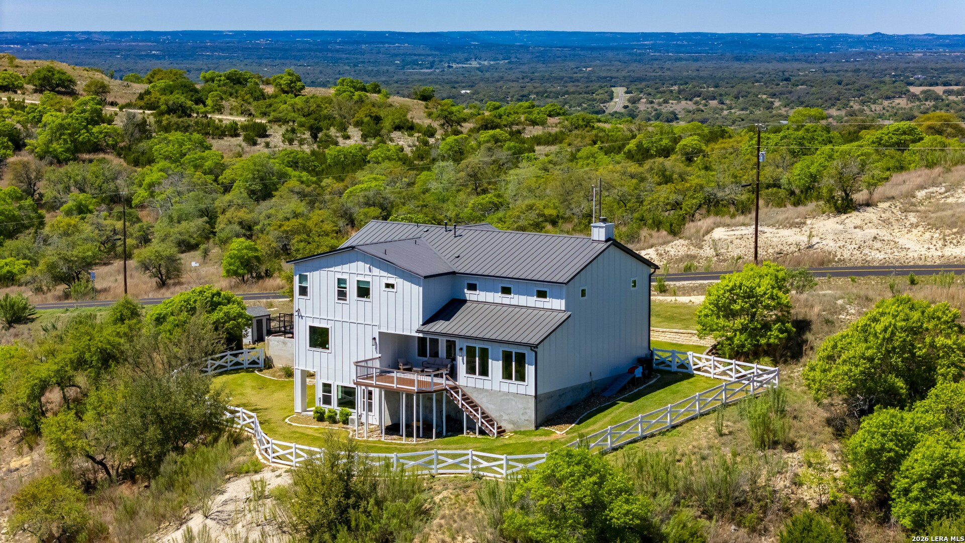 97 Coleman Springs Boerne, TX 78006 - Photo 14 of 70 a view of a big house with a big yard and large tree