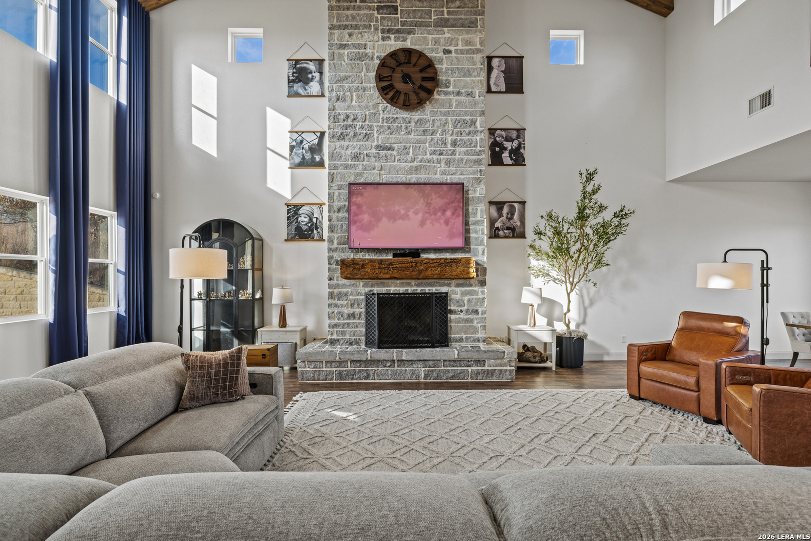 97 Coleman Springs Boerne, TX 78006 - Photo 20 of 86 a living room with furniture a fireplace and a flat screen tv