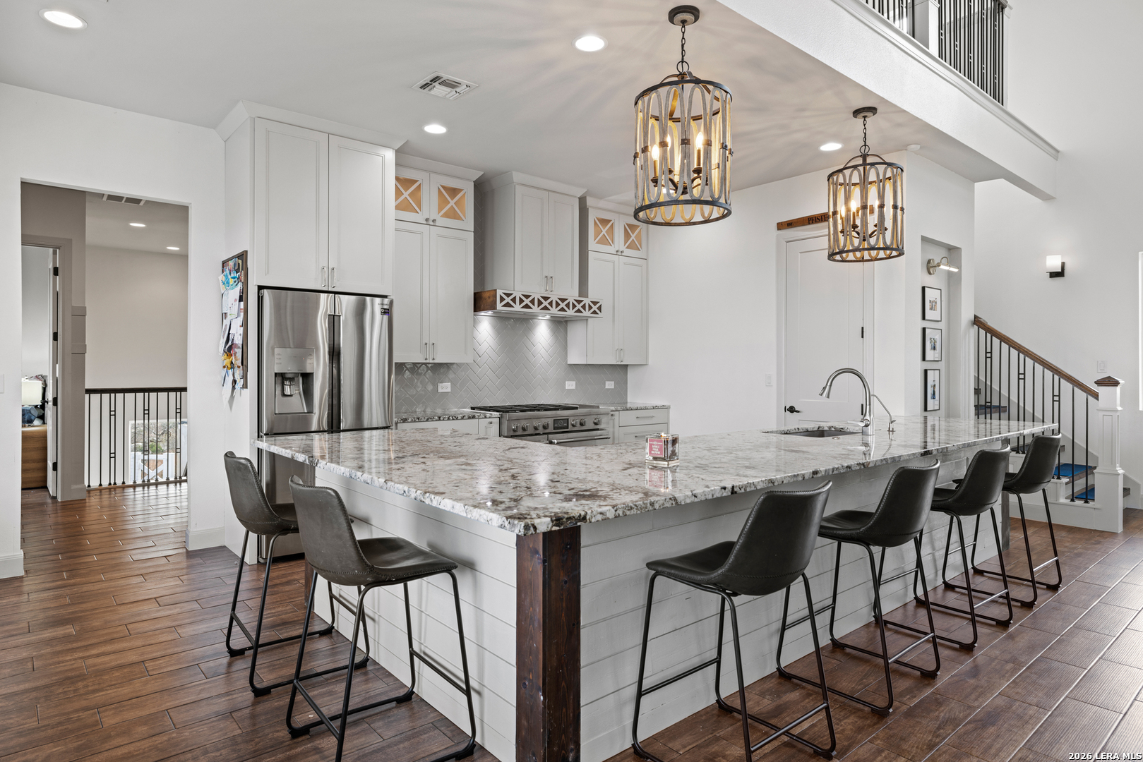 97 Coleman Springs Boerne, TX 78006 - Photo 29 of 86 a kitchen with stainless steel appliances kitchen island granite countertop a dining table chairs and granite counter tops