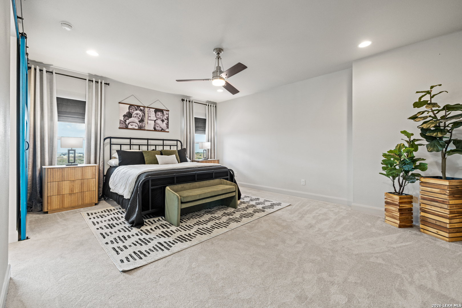 97 Coleman Springs Boerne, TX 78006 - Photo 38 of 86 a bedroom with a bed and a chandelier