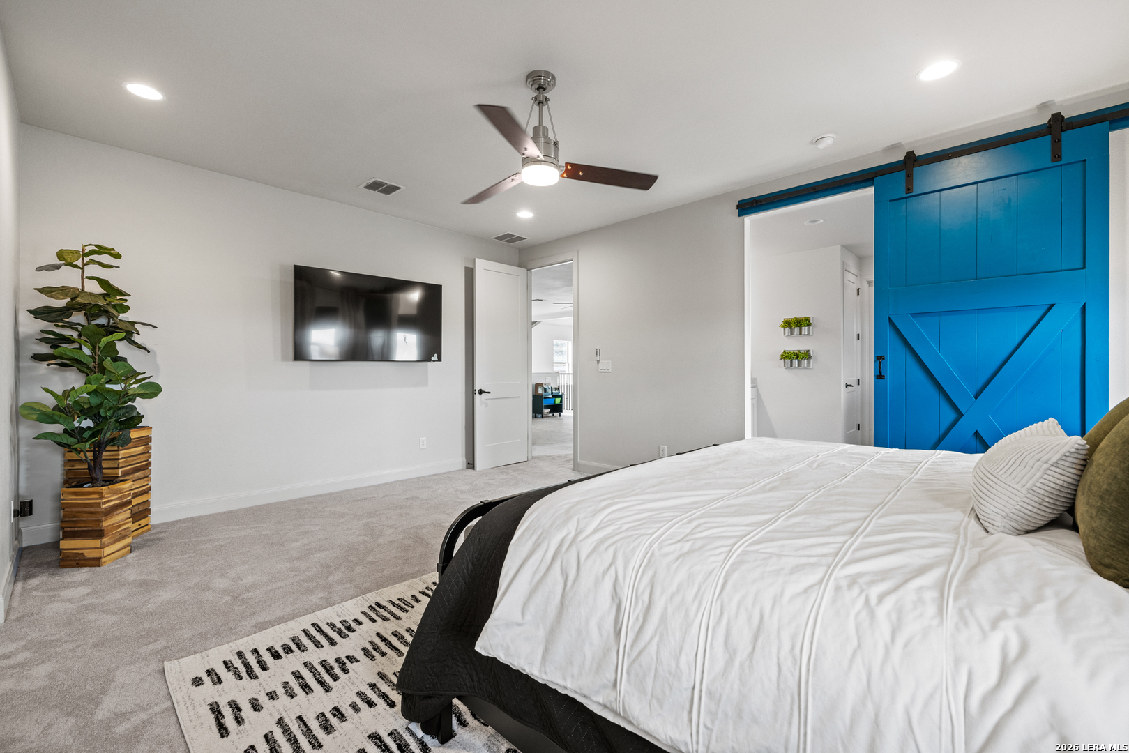 97 Coleman Springs Boerne, TX 78006 - Photo 40 of 86 a bedroom with a bed and a flat screen tv
