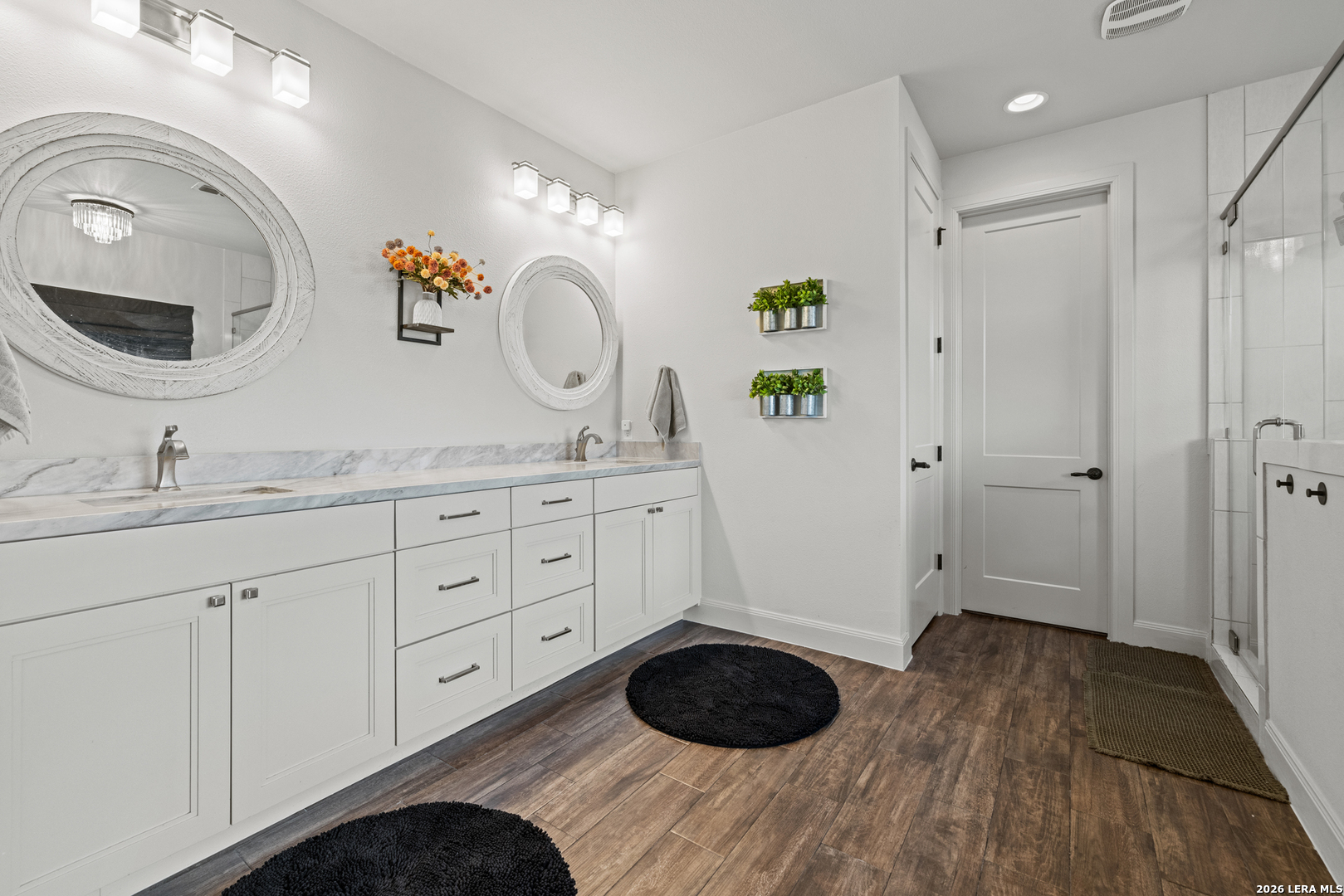 97 Coleman Springs Boerne, TX 78006 - Photo 42 of 86 a spacious bathroom with a granite countertop sink and a mirror