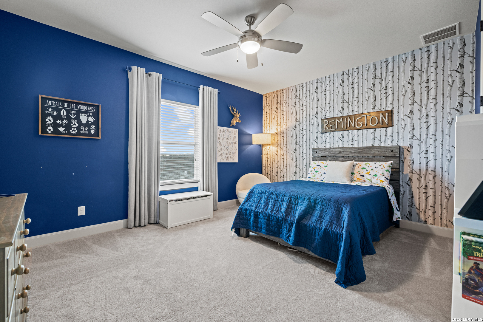 97 Coleman Springs Boerne, TX 78006 - Photo 47 of 86 a spacious bedroom with a bed and a chandelier