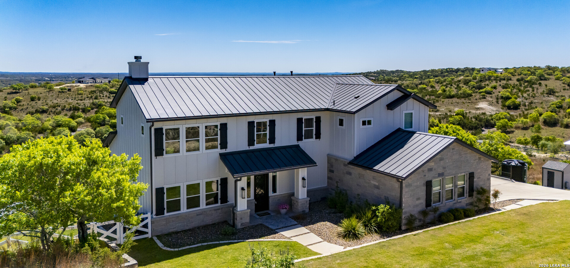 97 Coleman Springs Boerne, TX 78006 - Photo 5 of 70 a aerial view of a house with roof deck