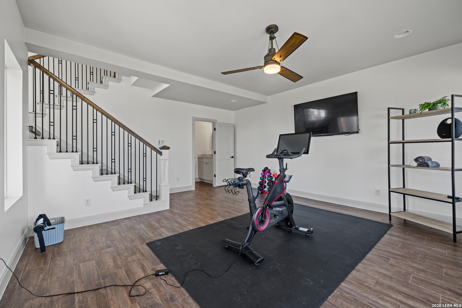 97 Coleman Springs Boerne, TX 78006 - Photo 55 of 86 a view of a livingroom with wooden floor and a flat screen tv