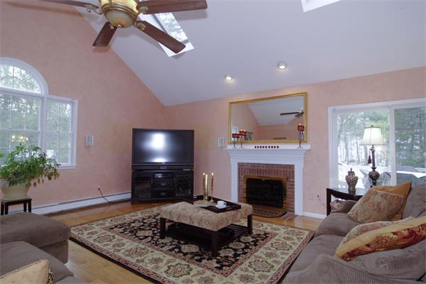 227 Joseph Road Boxborough, MA 01719 - Photo 8 of 27 a living room with furniture and a fireplace