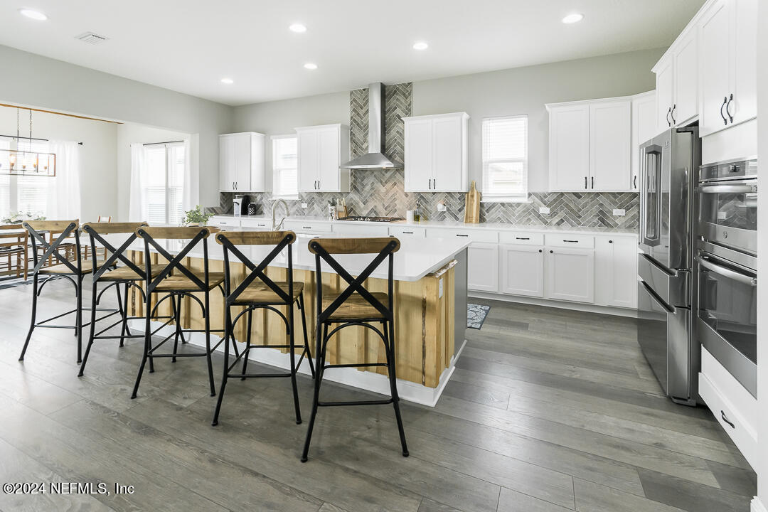36 Leafmore Lane St. Augustine, FL 32092 - Photo 12 of 38 a kitchen with stainless steel appliances granite countertop a stove a sink and a refrigerator