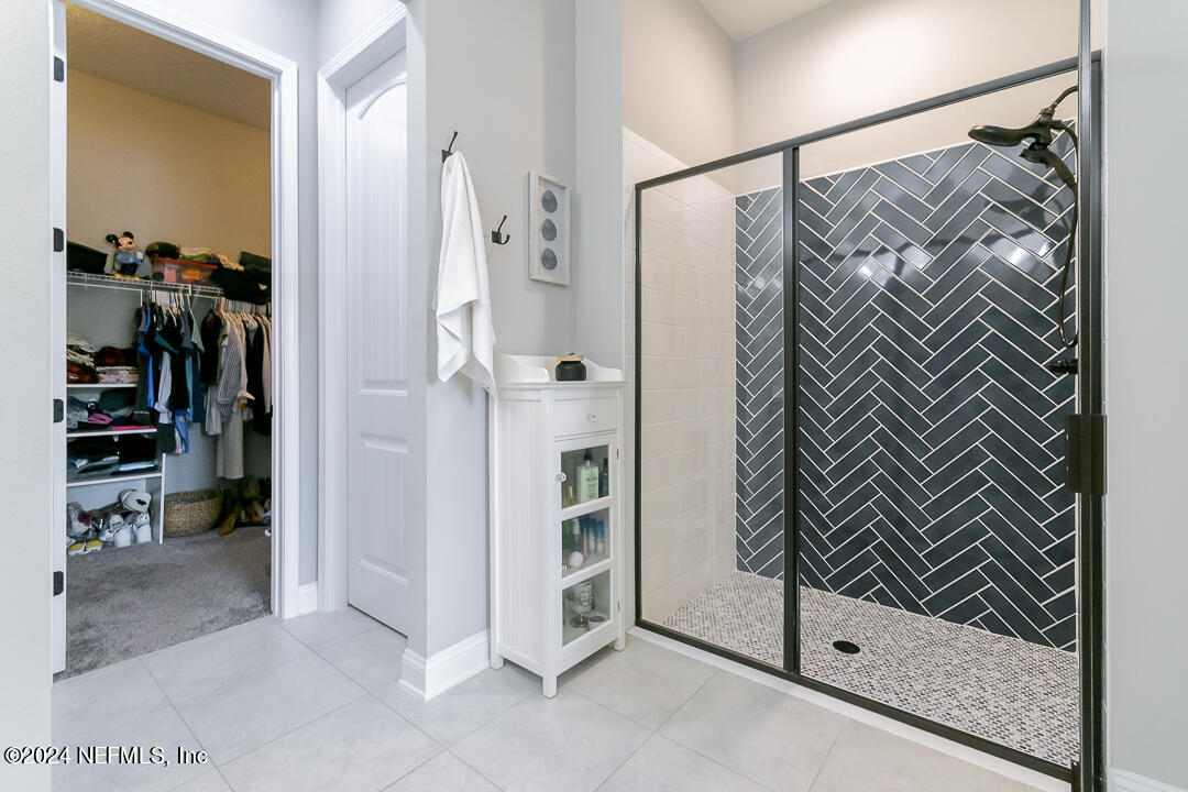 36 Leafmore Lane St. Augustine, FL 32092 - Photo 18 of 38 a view of walk in closet with clothes and shoes