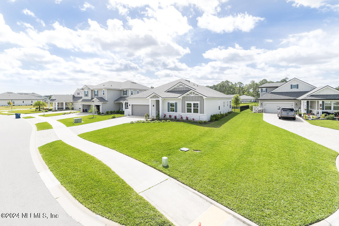 36 Leafmore Lane St. Augustine, FL 32092 - Photo 2 of 38 a view of an outdoor space with swimming pool and lounge chair