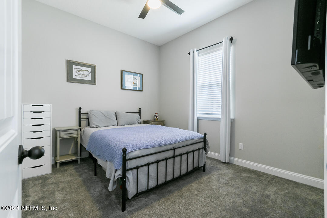 36 Leafmore Lane St. Augustine, FL 32092 - Photo 20 of 38 a bedroom with a bed and a tv on the dresser