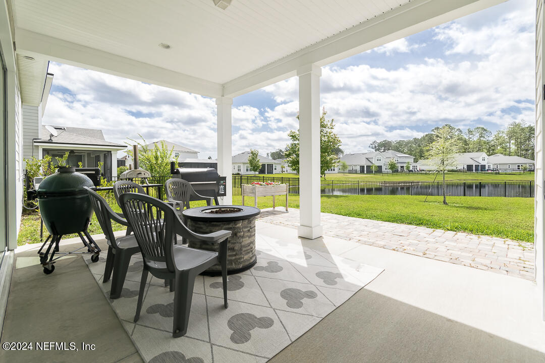 36 Leafmore Lane St. Augustine, FL 32092 - Photo 25 of 38 a view of a patio with a table chairs and garden