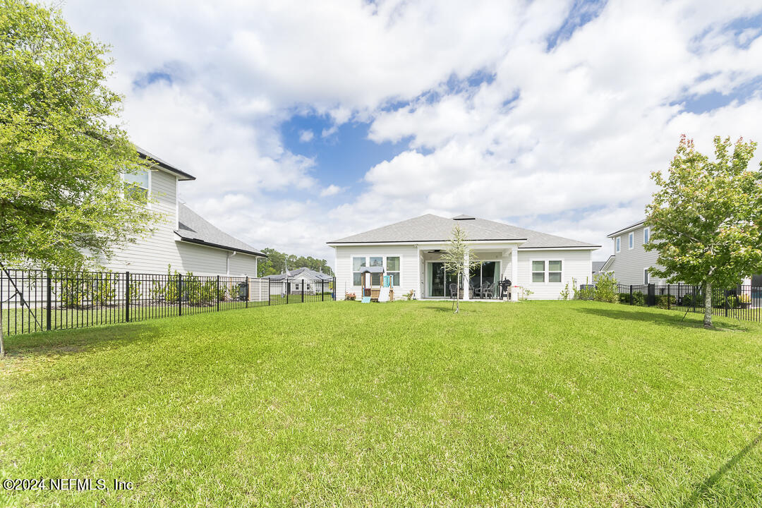 36 Leafmore Lane St. Augustine, FL 32092 - Photo 28 of 38 a front view of a house with a garden