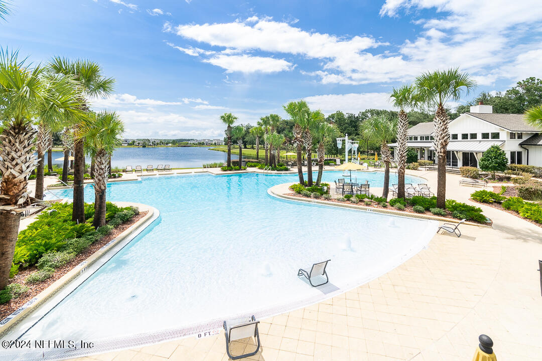 36 Leafmore Lane St. Augustine, FL 32092 - Photo 35 of 38 a view of a swimming pool and trees in the background