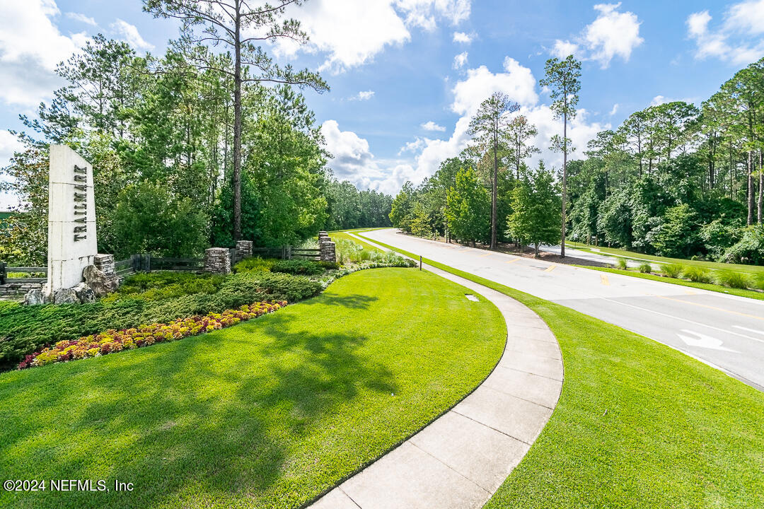 36 Leafmore Lane St. Augustine, FL 32092 - Photo 36 of 38 a view of a swimming pool with a yard and large trees