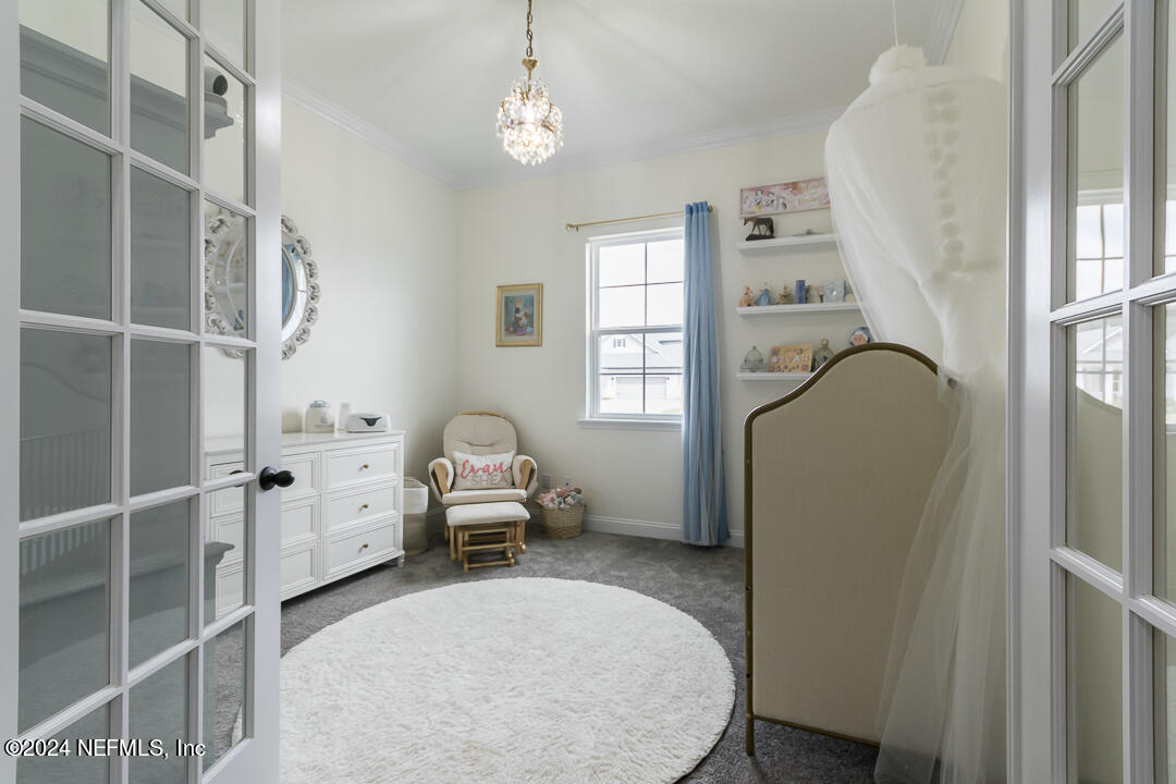 36 Leafmore Lane St. Augustine, FL 32092 - Photo 6 of 38 a bedroom with a bed and a dresser