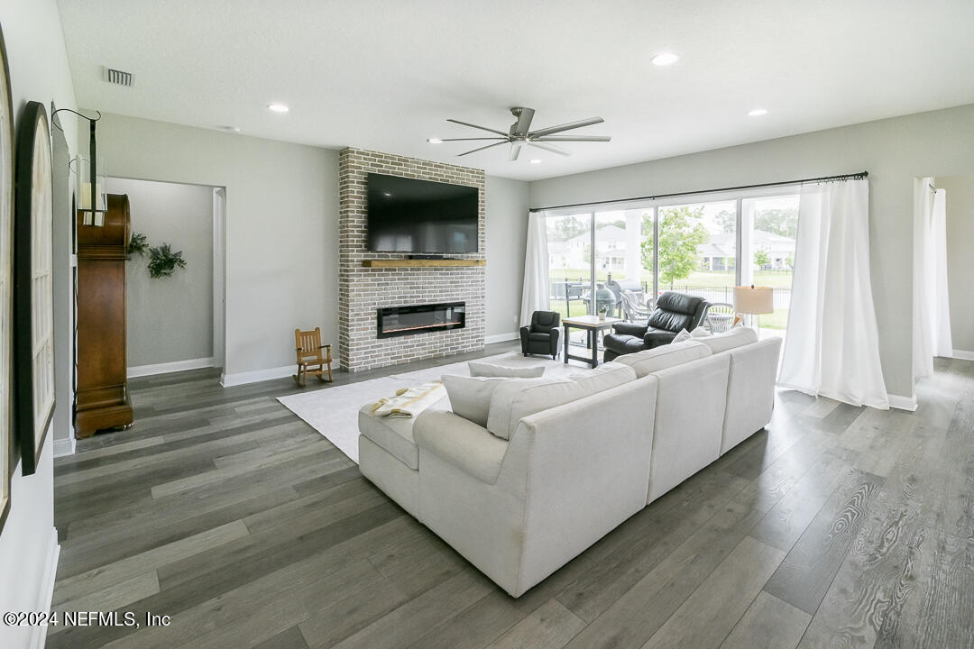 36 Leafmore Lane St. Augustine, FL 32092 - Photo 8 of 38 a living room with furniture and a flat screen tv
