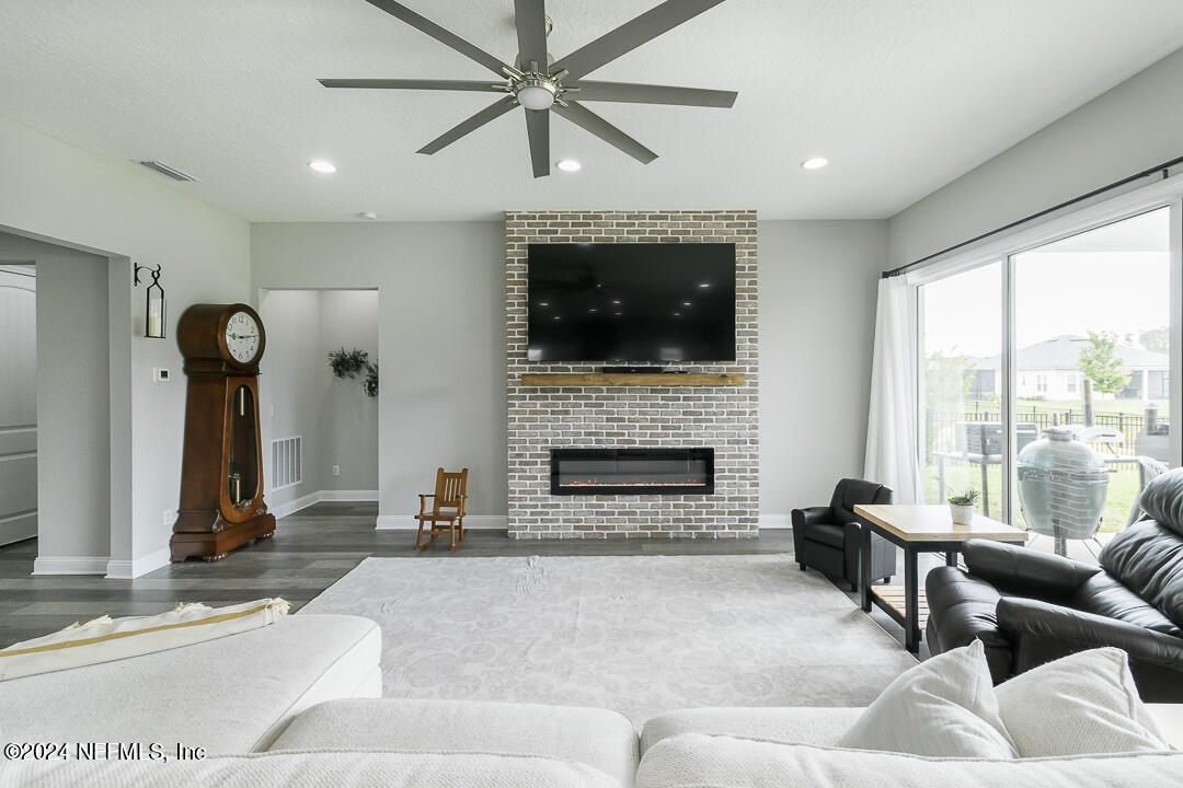 36 Leafmore Lane St. Augustine, FL 32092 - Photo 9 of 38 a living room with furniture and a fireplace