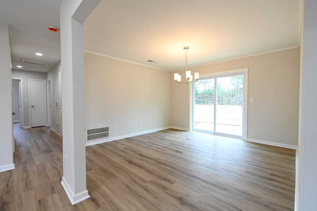 718 Wedron Drive Columbus, GA 31907 - Photo 17 of 38 a view of an empty room with wooden floor and a window
