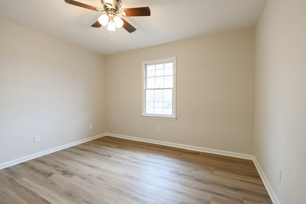 718 Wedron Drive Columbus, GA 31907 - Photo 25 of 38 wooden floor in an empty room with a window