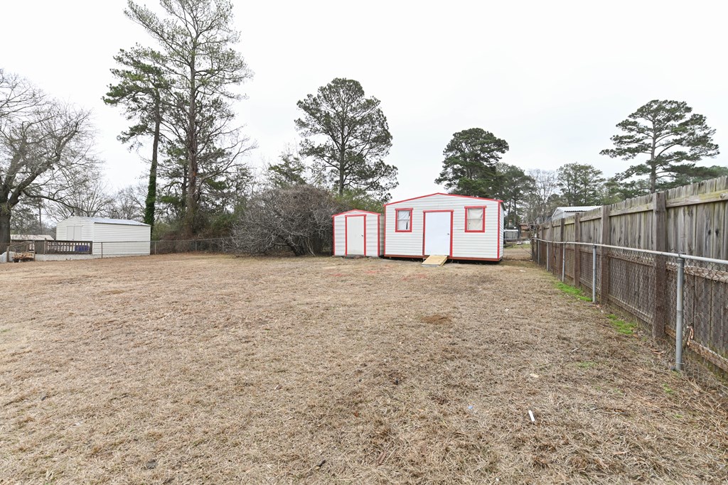 718 Wedron Drive Columbus, GA 31907 - Photo 37 of 38 a view of a white house next to a yard with large trees