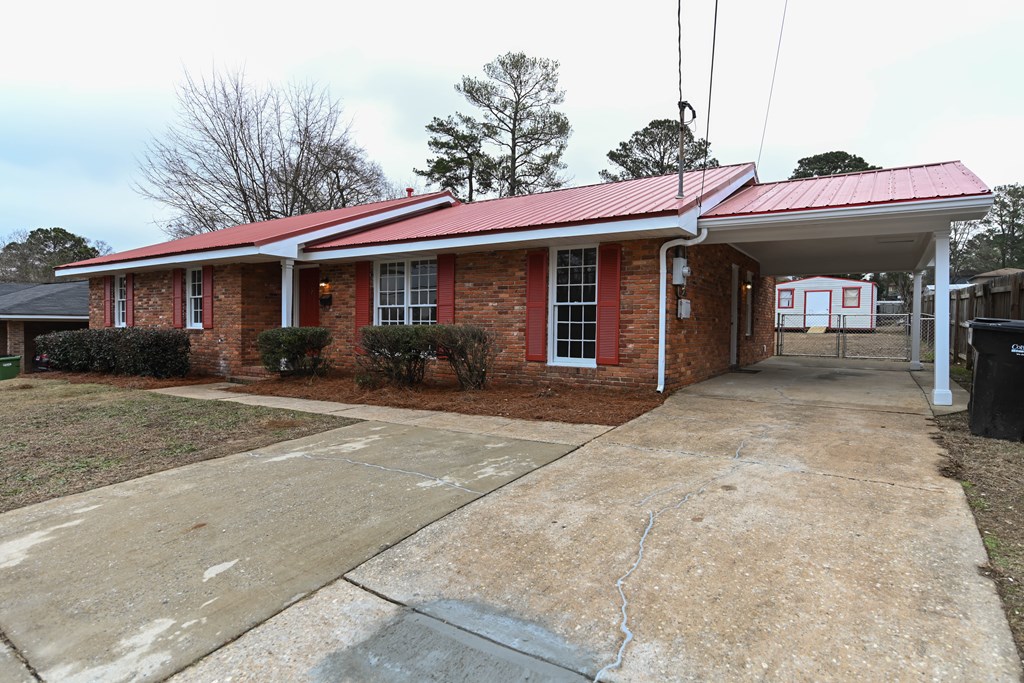 718 Wedron Drive Columbus, GA 31907 - Photo 4 of 38 a front view of a house with garden and plants