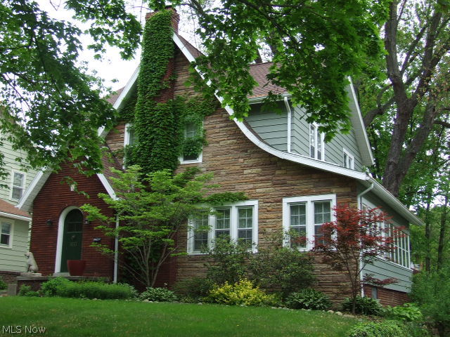 653 Ecton Road Akron, OH 44303 - Photo 24 of 25 View of the front of the house and the enclosed side porch.