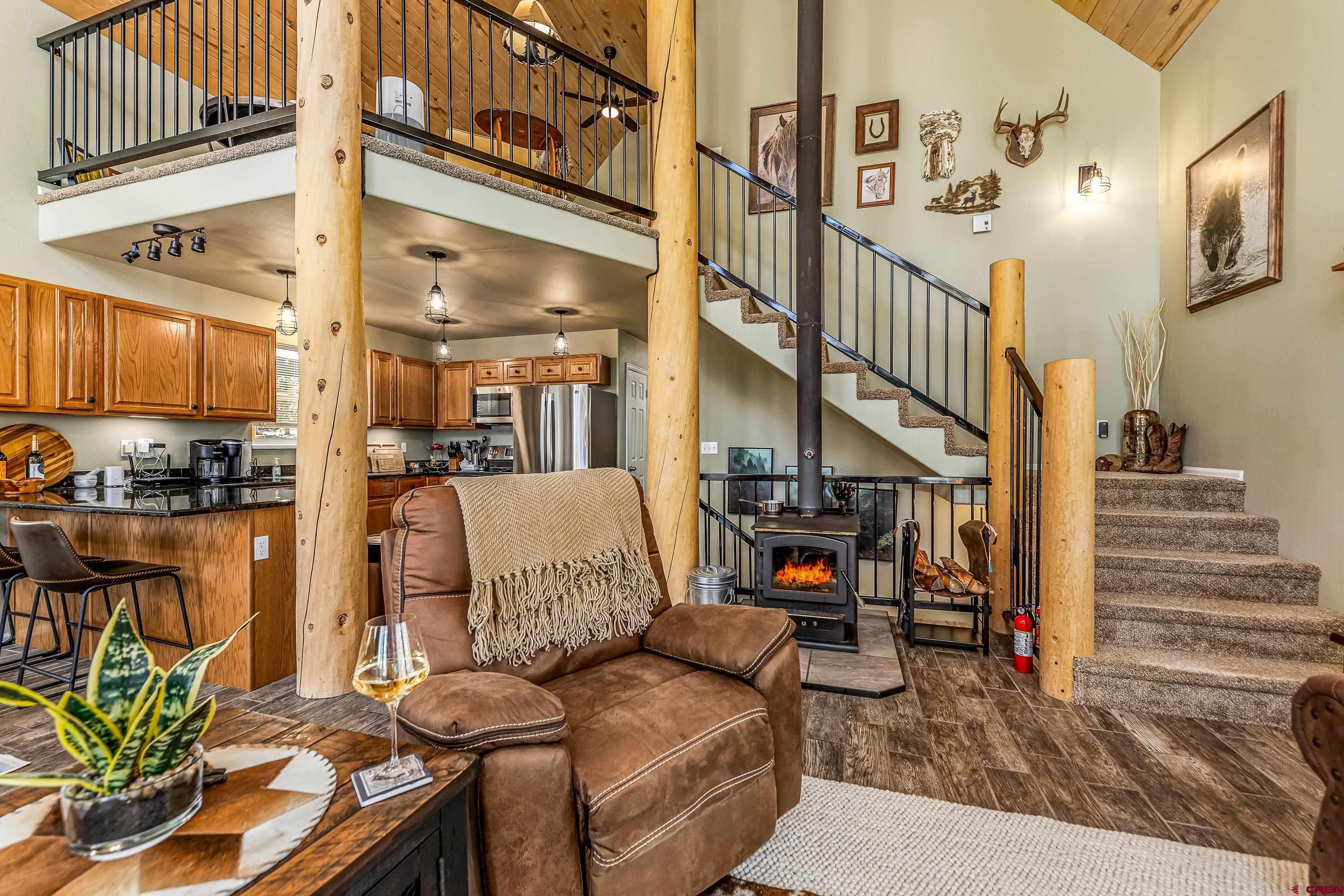 303 Spruce Road Cimarron, CO 81220 - Photo 11 of 35 a view of a livingroom with furniture and a kitchen