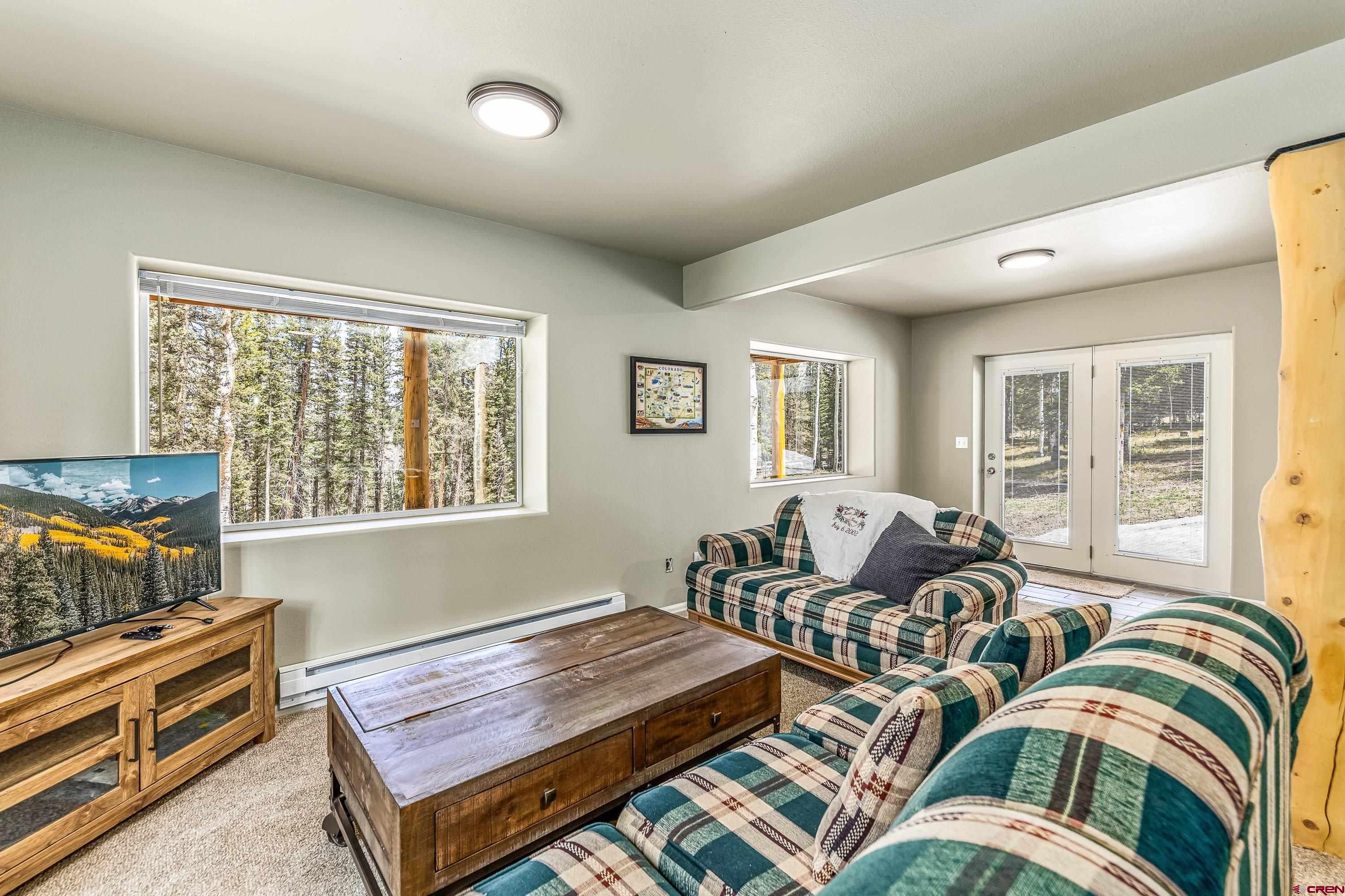 303 Spruce Road Cimarron, CO 81220 - Photo 19 of 35 a bedroom with furniture and a window