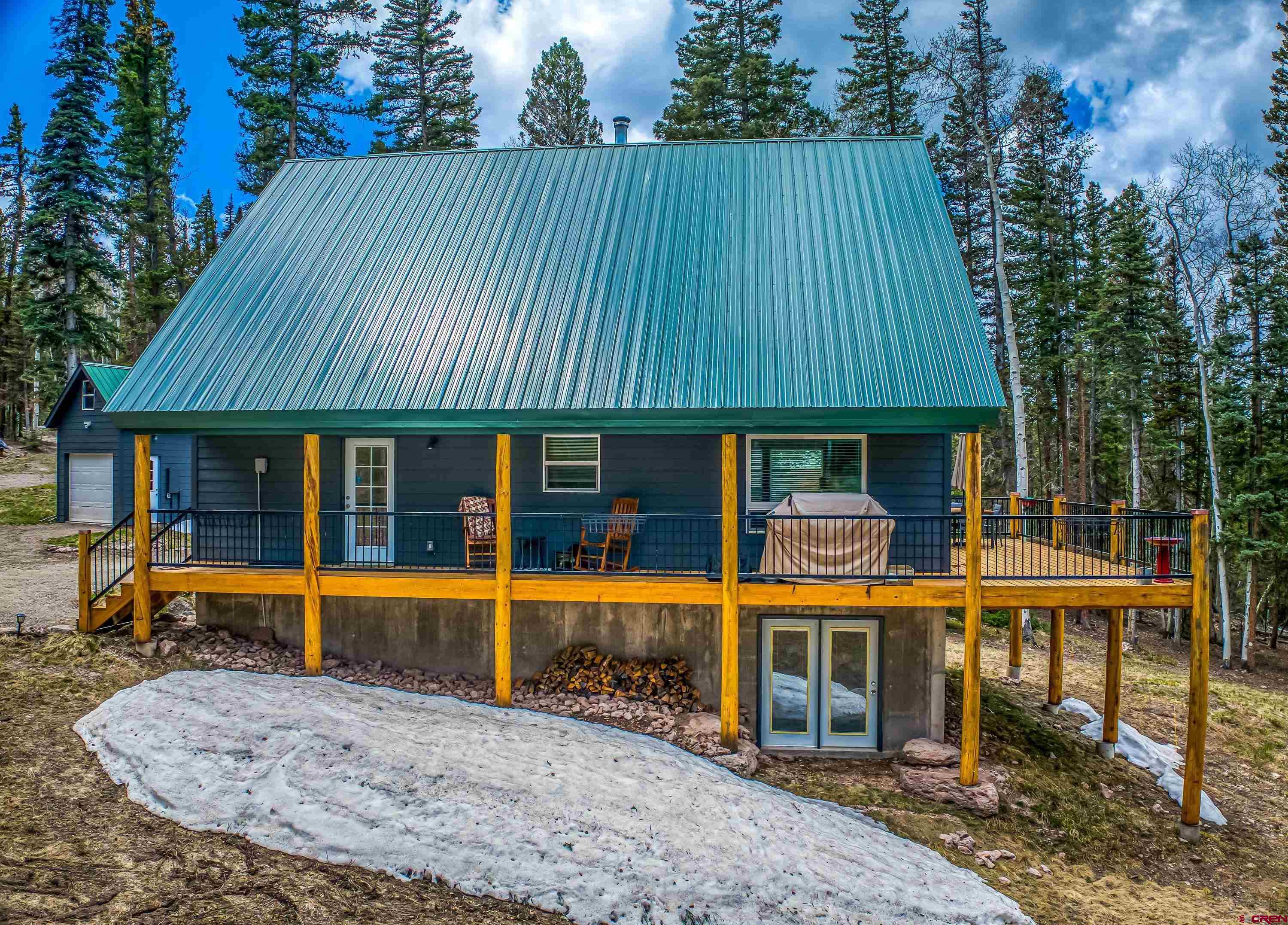 303 Spruce Road Cimarron, CO 81220 - Photo 5 of 35 an outdoor view of house with green space