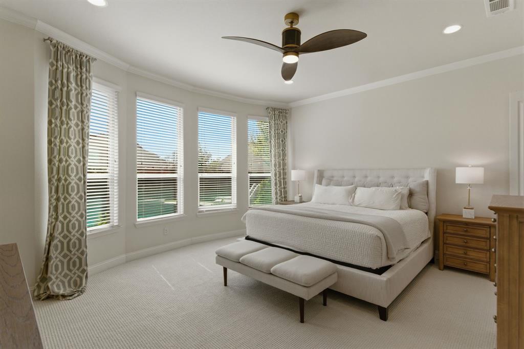 2801 Seabiscuit Road Celina, TX 75009 - Photo 15 of 39 a spacious bedroom with a bed couch and window