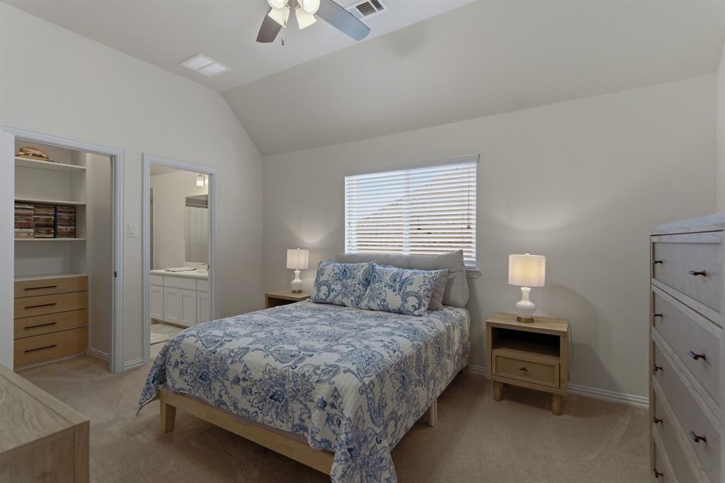 2801 Seabiscuit Road Celina, TX 75009 - Photo 25 of 39 a bedroom with a bed and a view of bedroom