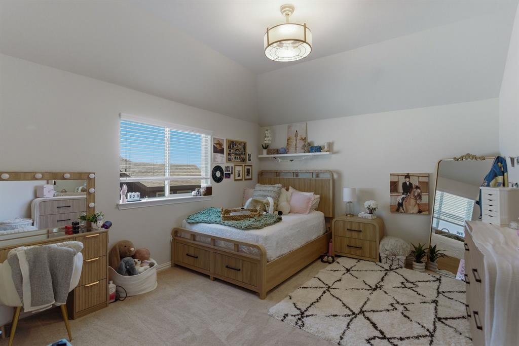 2801 Seabiscuit Road Celina, TX 75009 - Photo 27 of 39 a living room with furniture and a table