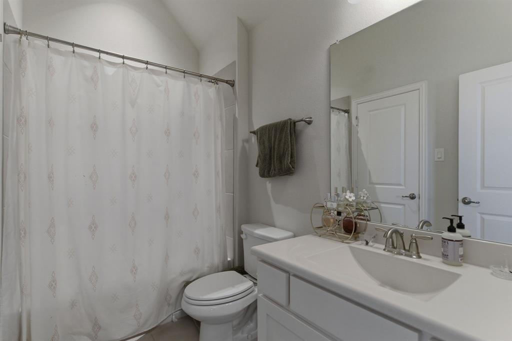 2801 Seabiscuit Road Celina, TX 75009 - Photo 28 of 39 a bathroom with a sink toilet and shower