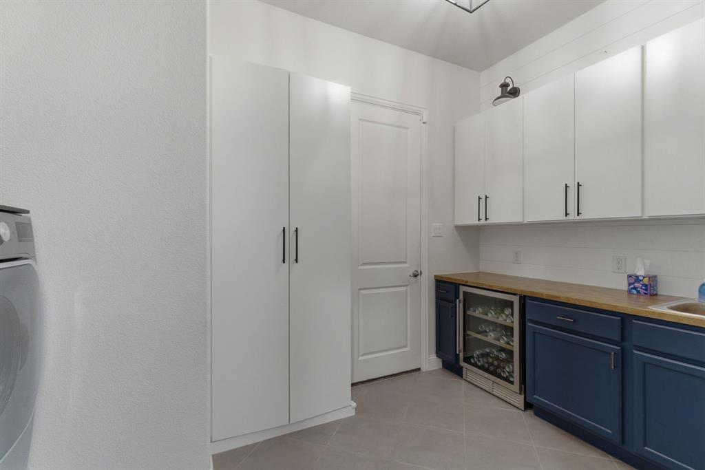 2801 Seabiscuit Road Celina, TX 75009 - Photo 30 of 39 a view of a kitchen with cabinets