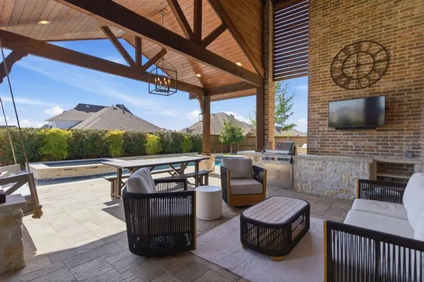 a brick house with a stove and a table