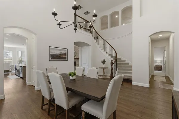 a view of a dining room with furniture and wooden floor
