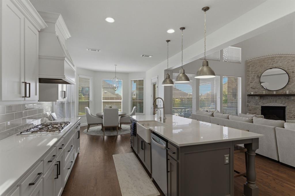 2801 Seabiscuit Road Celina, TX 75009 - Photo 39 of 39 a open kitchen with stainless steel appliances granite countertop a lot of counter space and a wooden floors