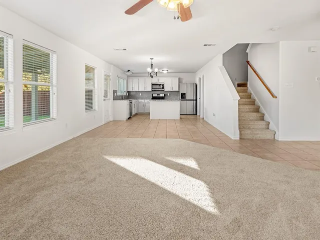 a view of a kitchen with furniture and windows