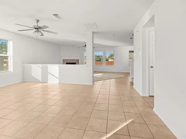 a view of a livingroom with a dishwasher cabinets and window