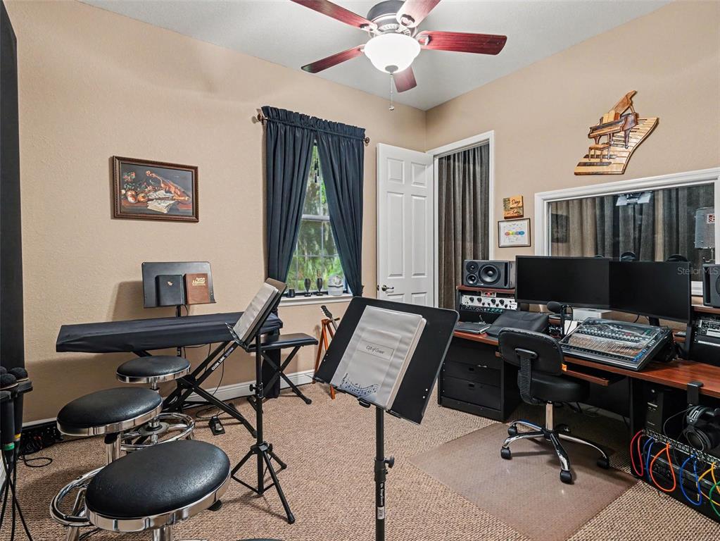 339 Corbett Road Lithia, FL 33547 - Photo 29 of 38 a work room with furniture and musical instruments