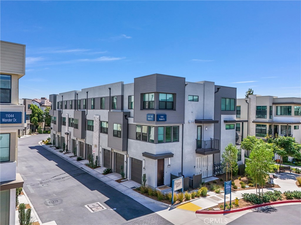 11057 Wander Drive Rancho Cucamonga, CA 91730 - Photo 1 of 1 a front view of a building with street view
