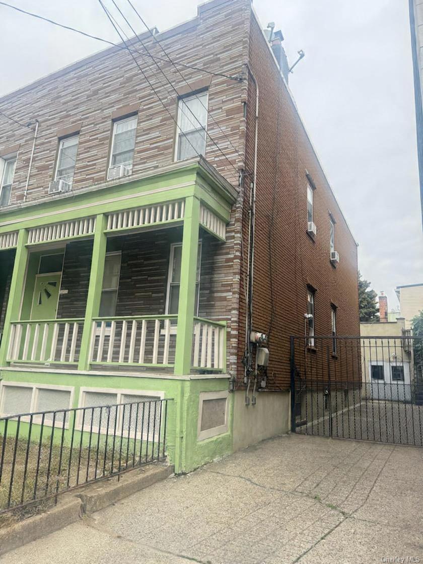 68-13 60th Street Queens, NY 11385 - Photo 1 of 27 a front view of a house