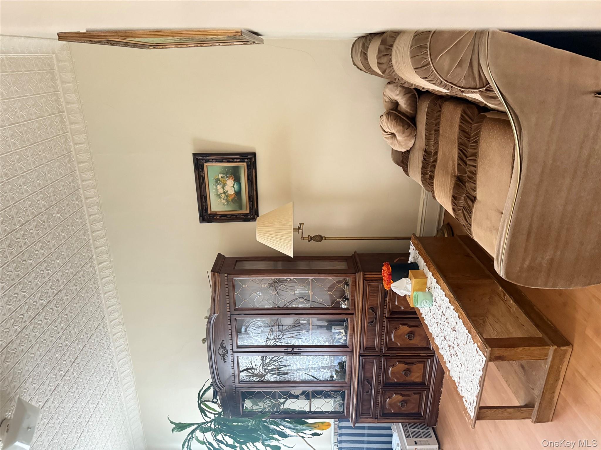 68-13 60th Street Queens, NY 11385 - Photo 19 of 27 a living room with furniture and a couch