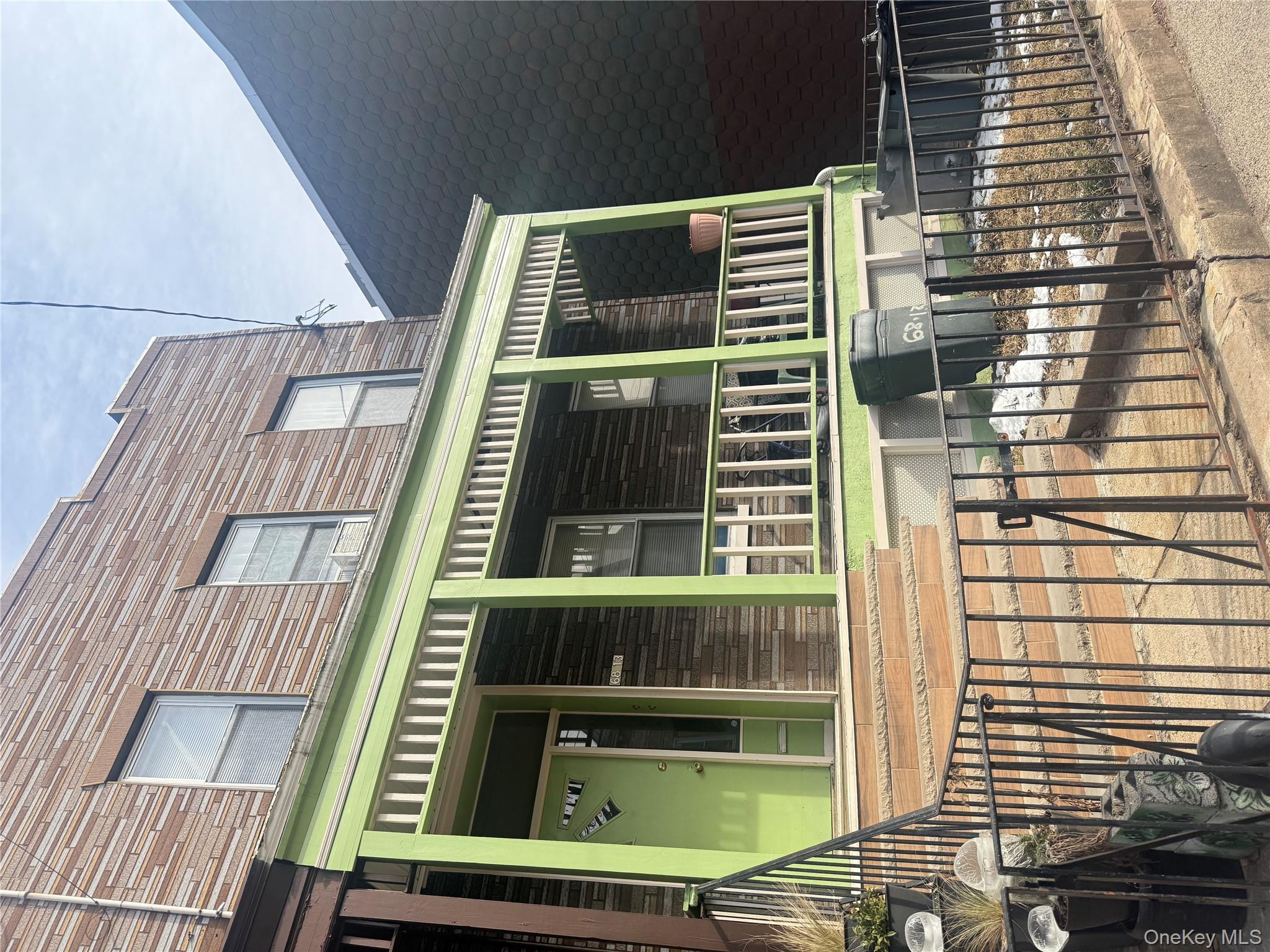 68-13 60th Street Queens, NY 11385 - Photo 2 of 27 a view of a brick building with a large window