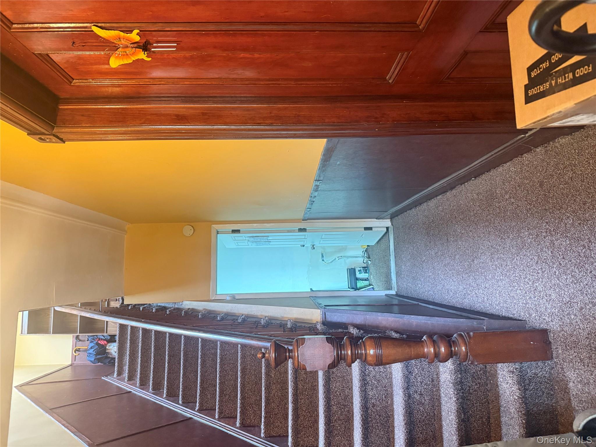 68-13 60th Street Queens, NY 11385 - Photo 5 of 27 a view of a staircase and wooden door